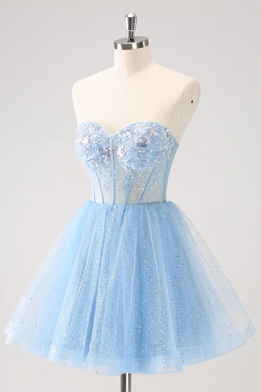 Side view of the short sky blue sweetheart sequin dress.