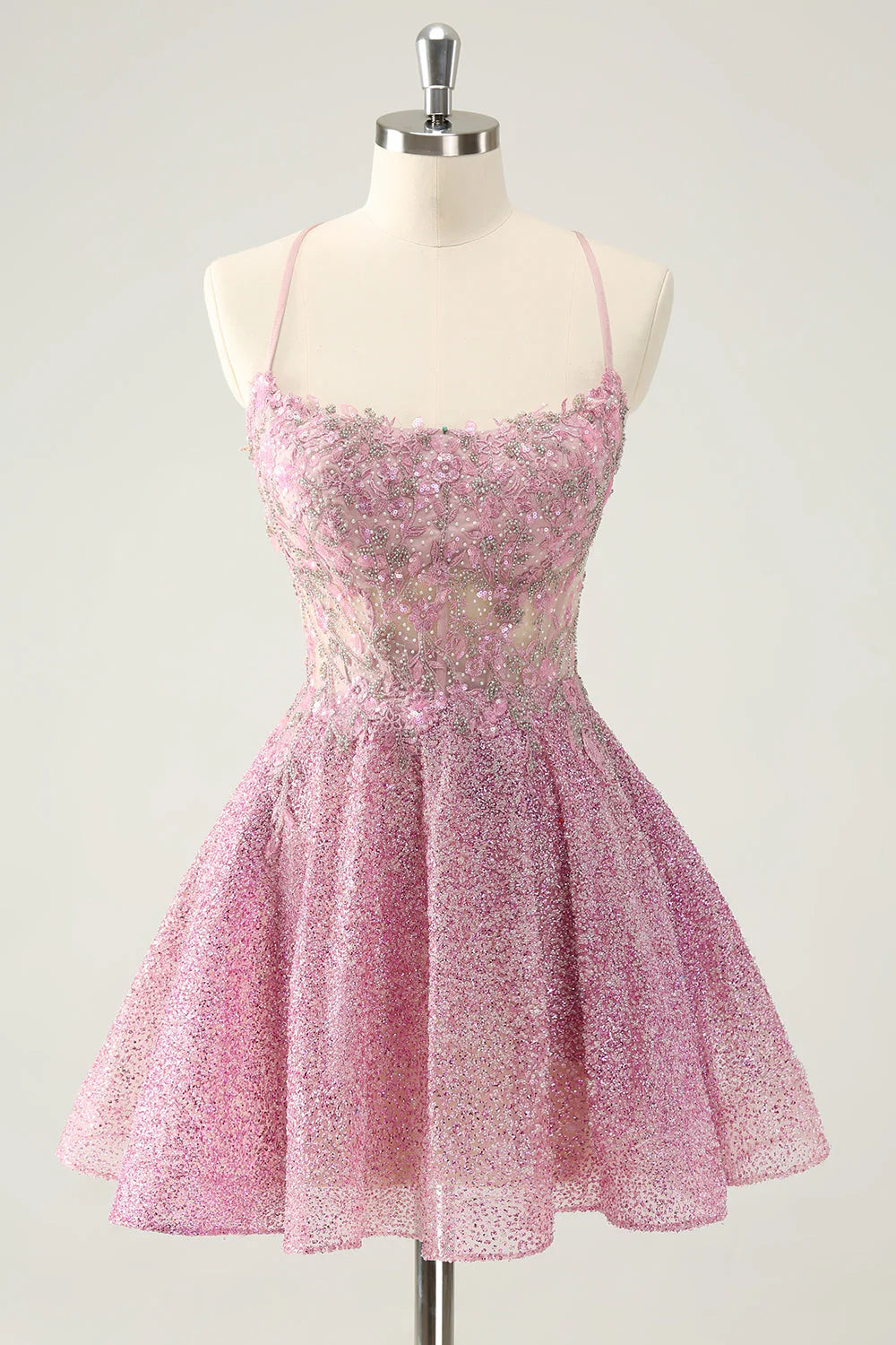 Sparkly dark pink A-line short homecoming dress with intricate beading and appliques.