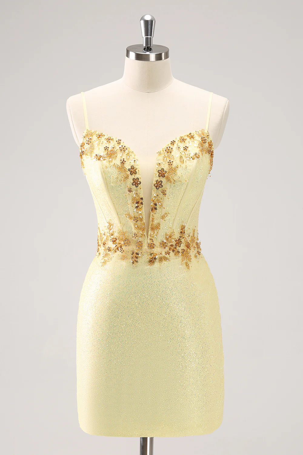Sparkly yellow bodycon corset dress with beading, front view.