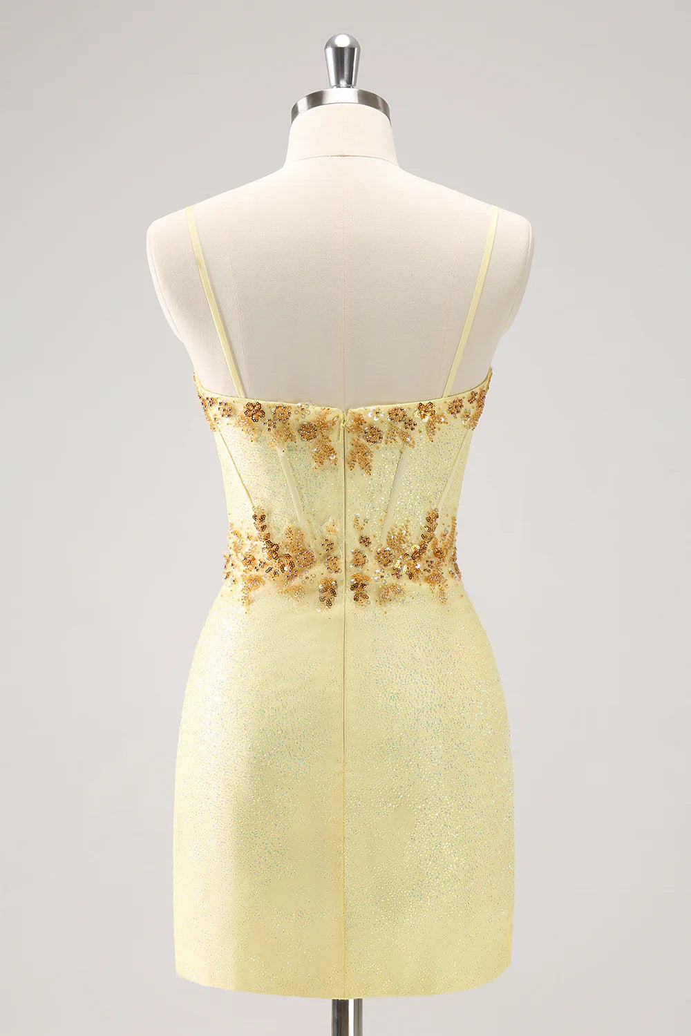 Sparkly yellow bodycon corset dress with beading, side view.
