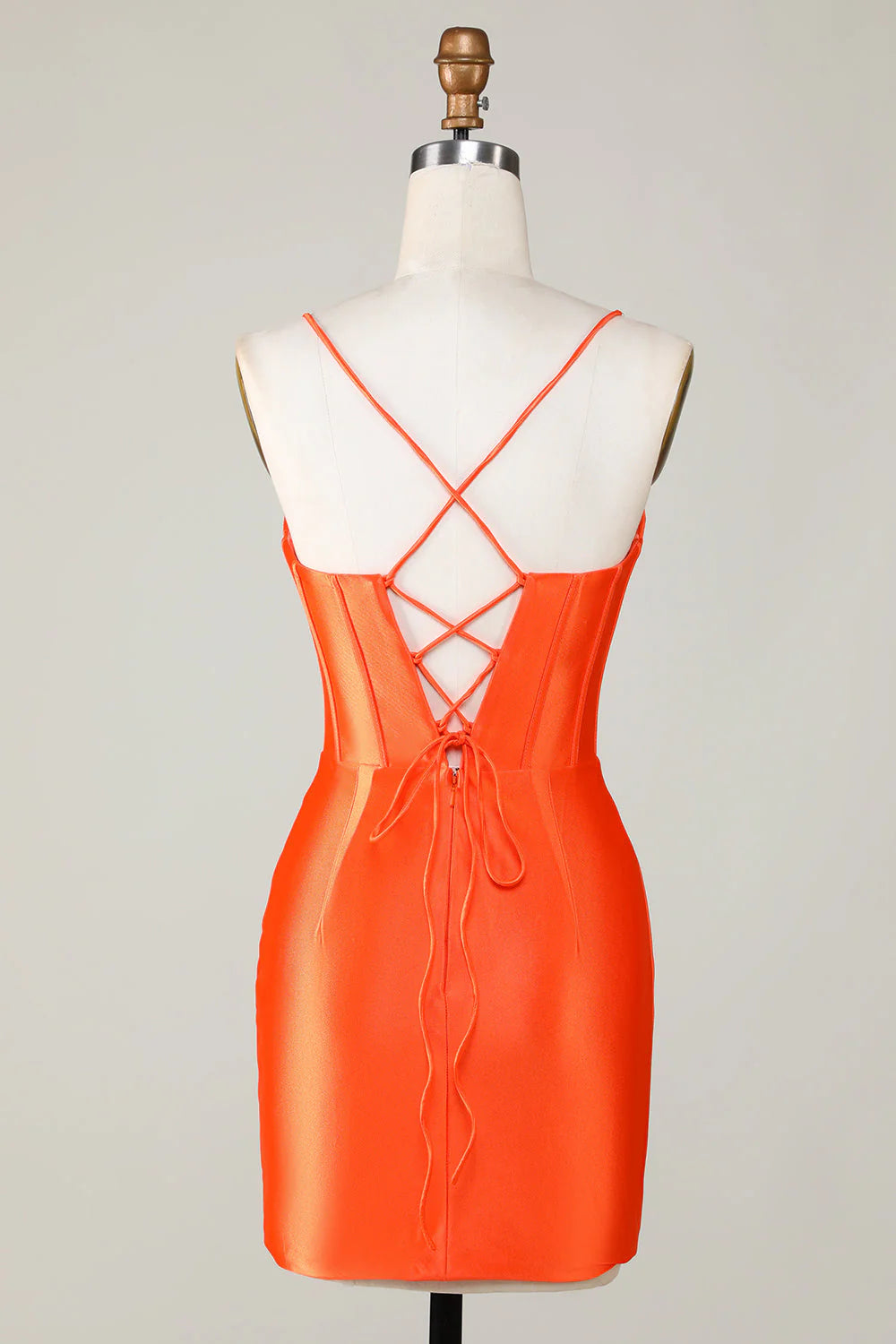 Back view of a sparkly orange beaded corset short homecoming dress.