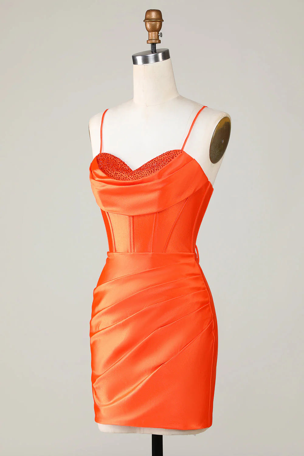 Side view of a sparkly orange beaded corset short homecoming dress.