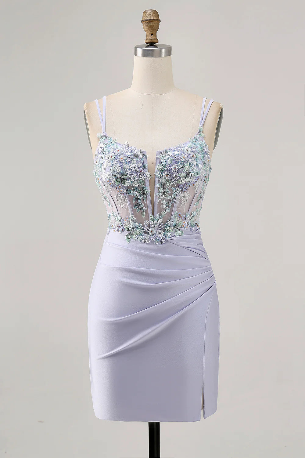 Model wearing a sparkly lavender tight homecoming dress with a lace-up corset back and a thigh-high slit.
