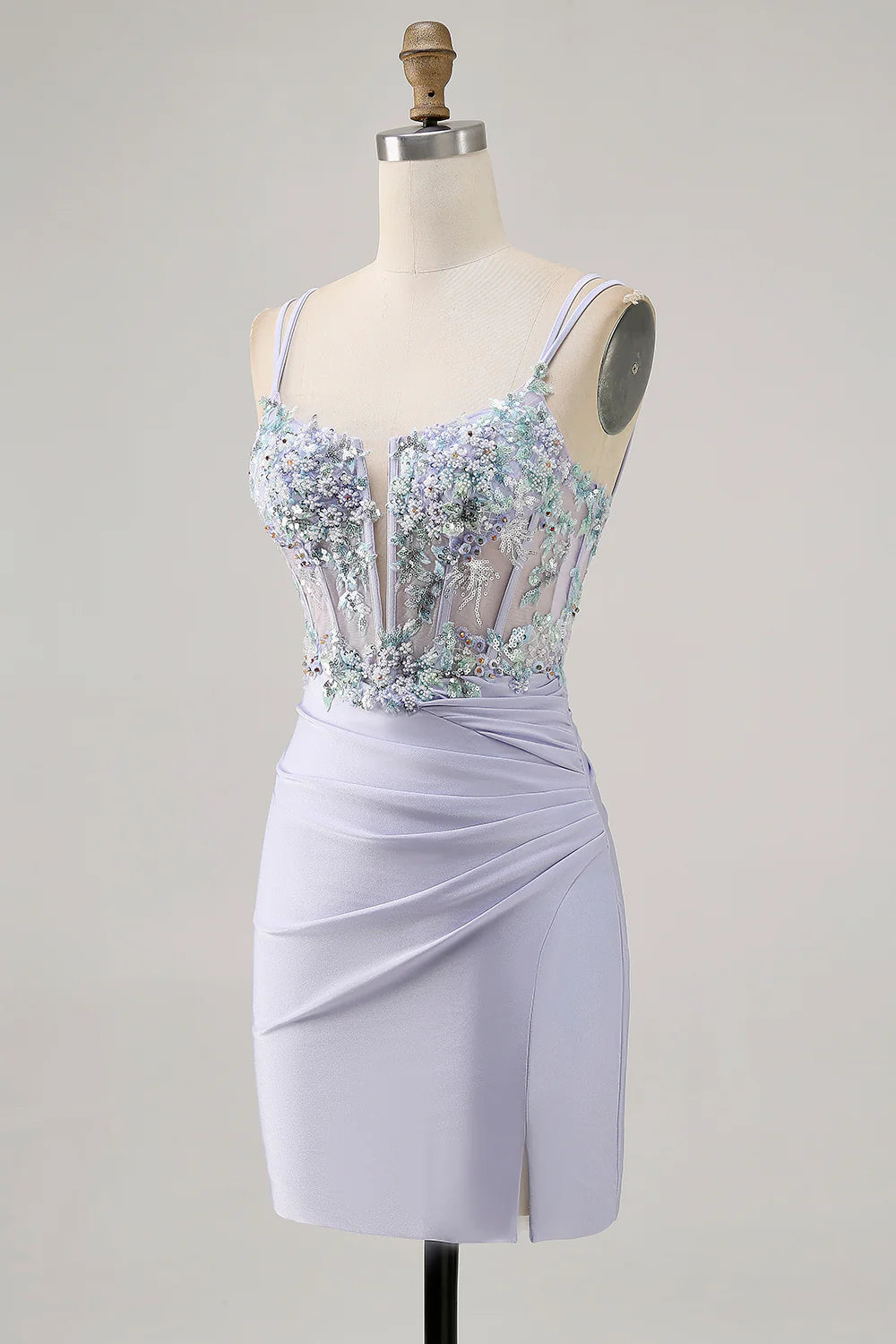 Side view of a model in a sparkly lavender beaded tight dress, highlighting the slit and fitted silhouette.