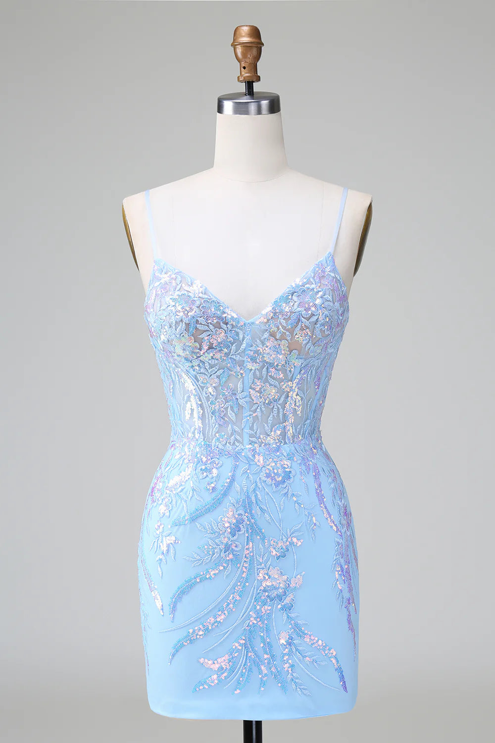 Model wearing a sparkly blue bodycon sequined short homecoming dress with spaghetti straps.