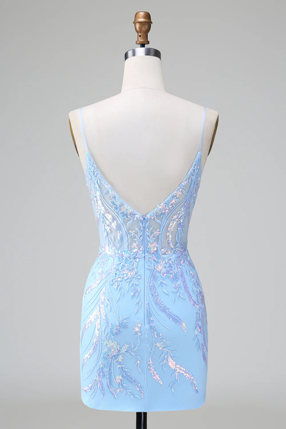 Side view of a model in a sparkly blue sequined bodycon dress.