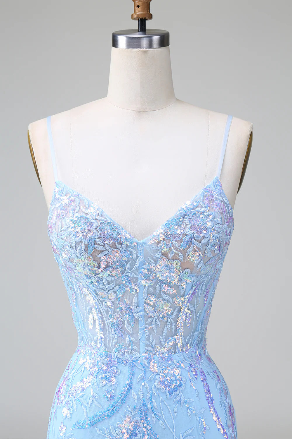 Back view of a sparkly blue short sequined dress with corset detail.