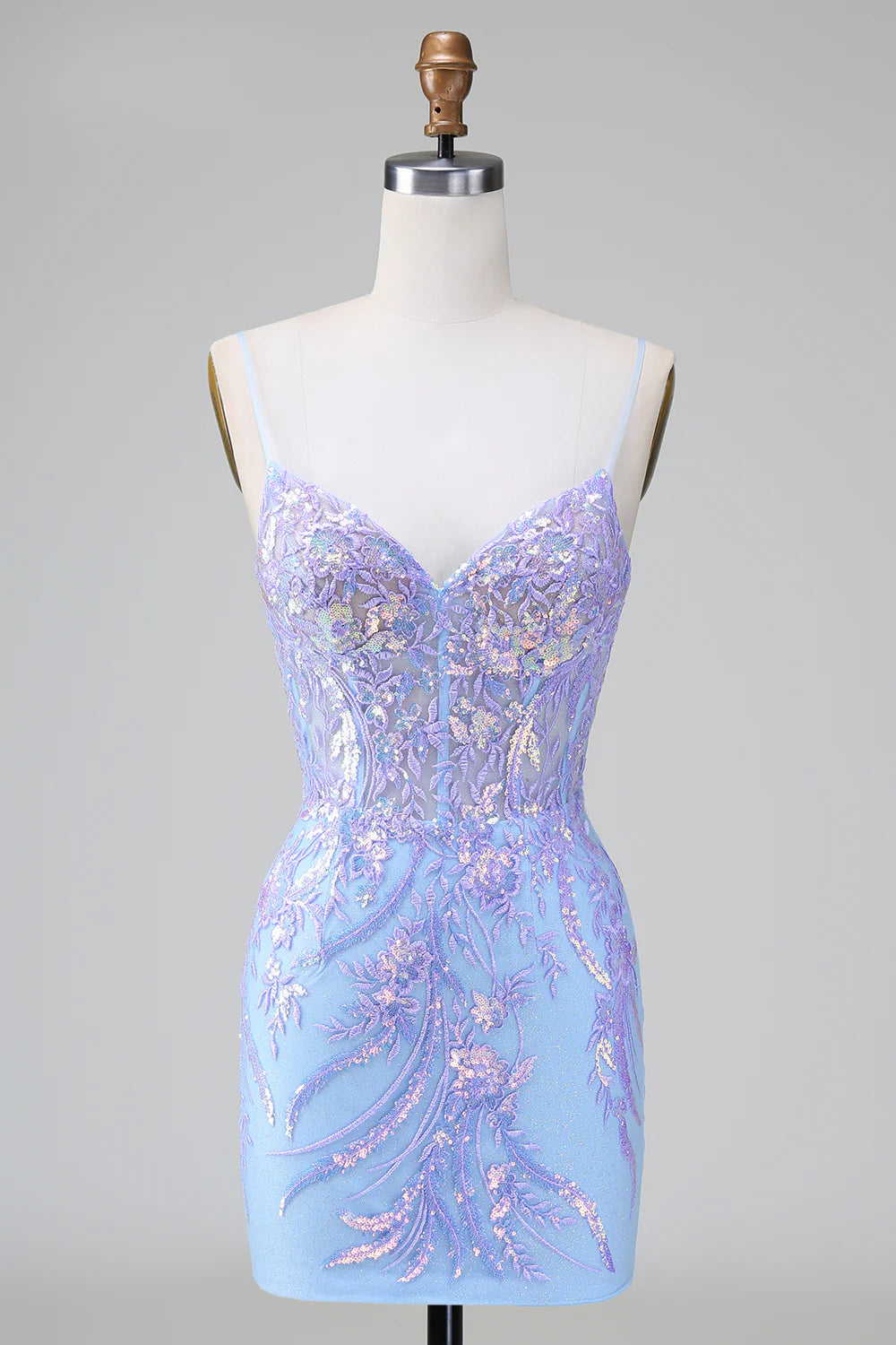 Model wearing a sparkly lilac blue bodycon sequined short homecoming dress.