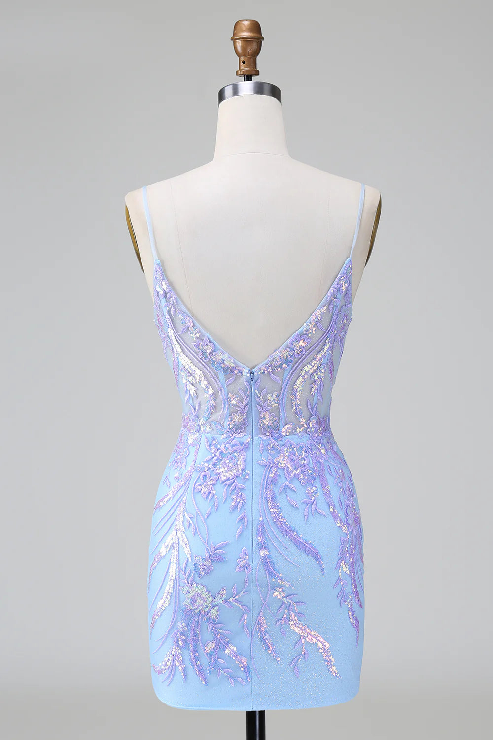 Side view of a model in a sparkly lilac blue sequined bodycon dress.