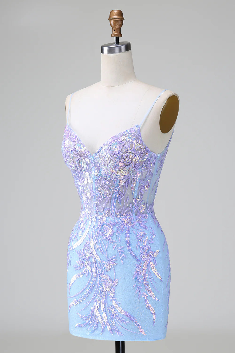 Back view of a sparkly lilac blue short sequined dress with corset detail.