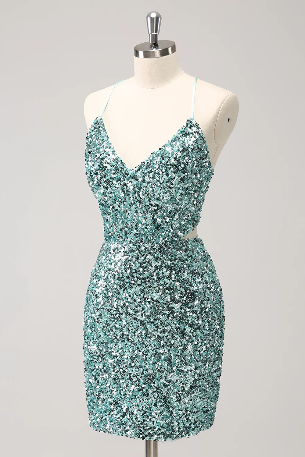 Side view of the sparkly blue sequin short dress, showing the thigh-high slit.