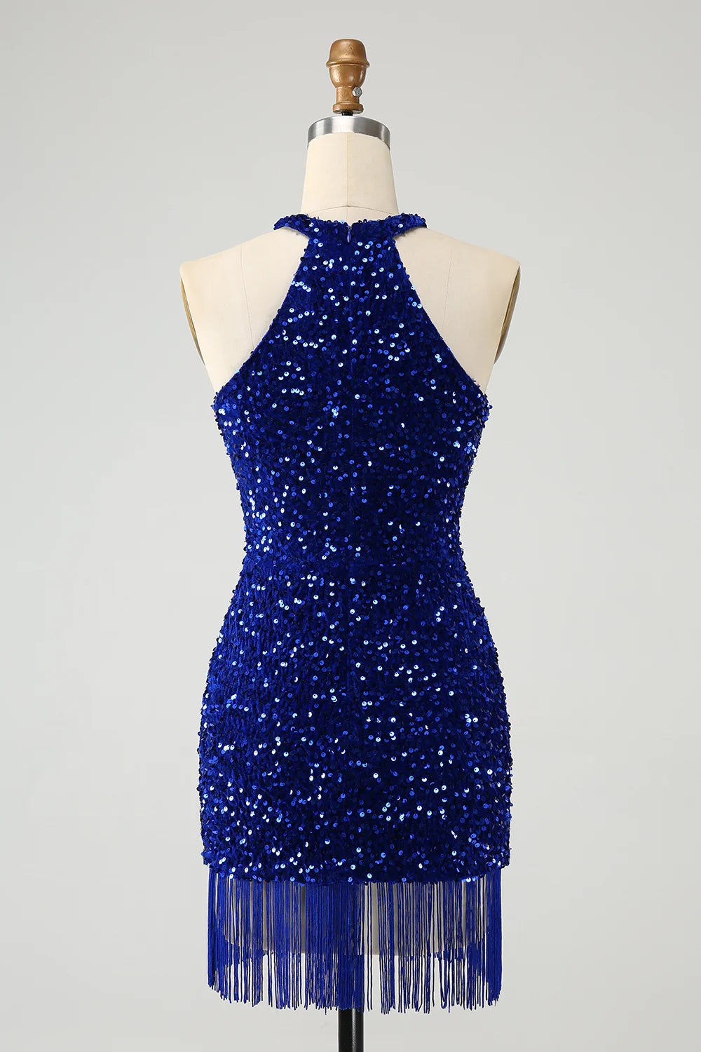 Back view of a sparkly royal blue sequin short dress with halter neckline.