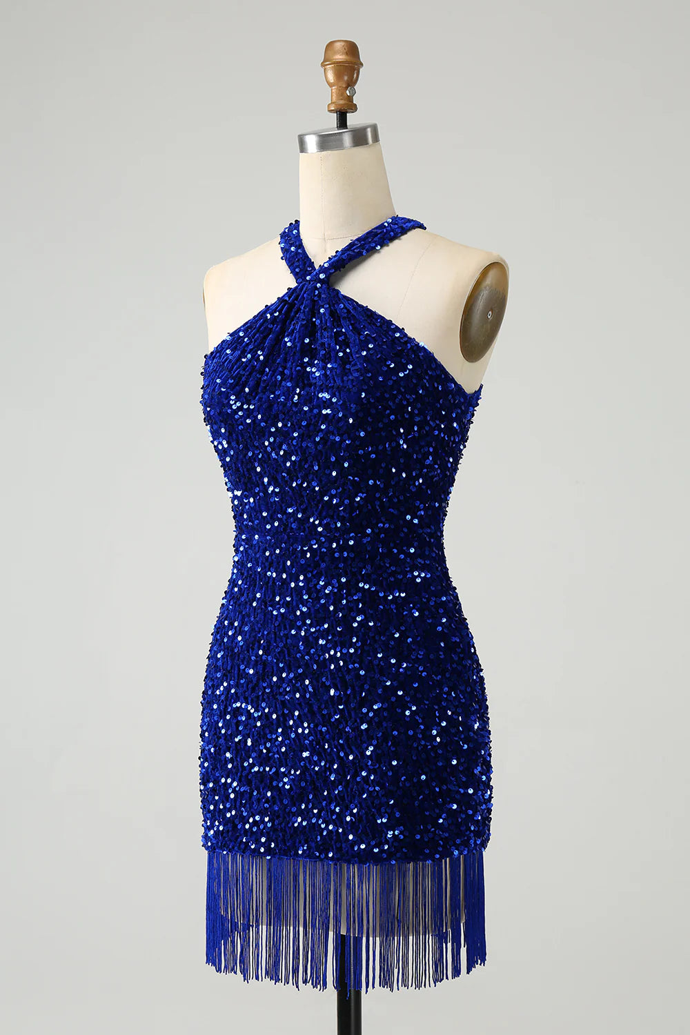Side view of a royal blue sequin bodycon dress with tassels.
