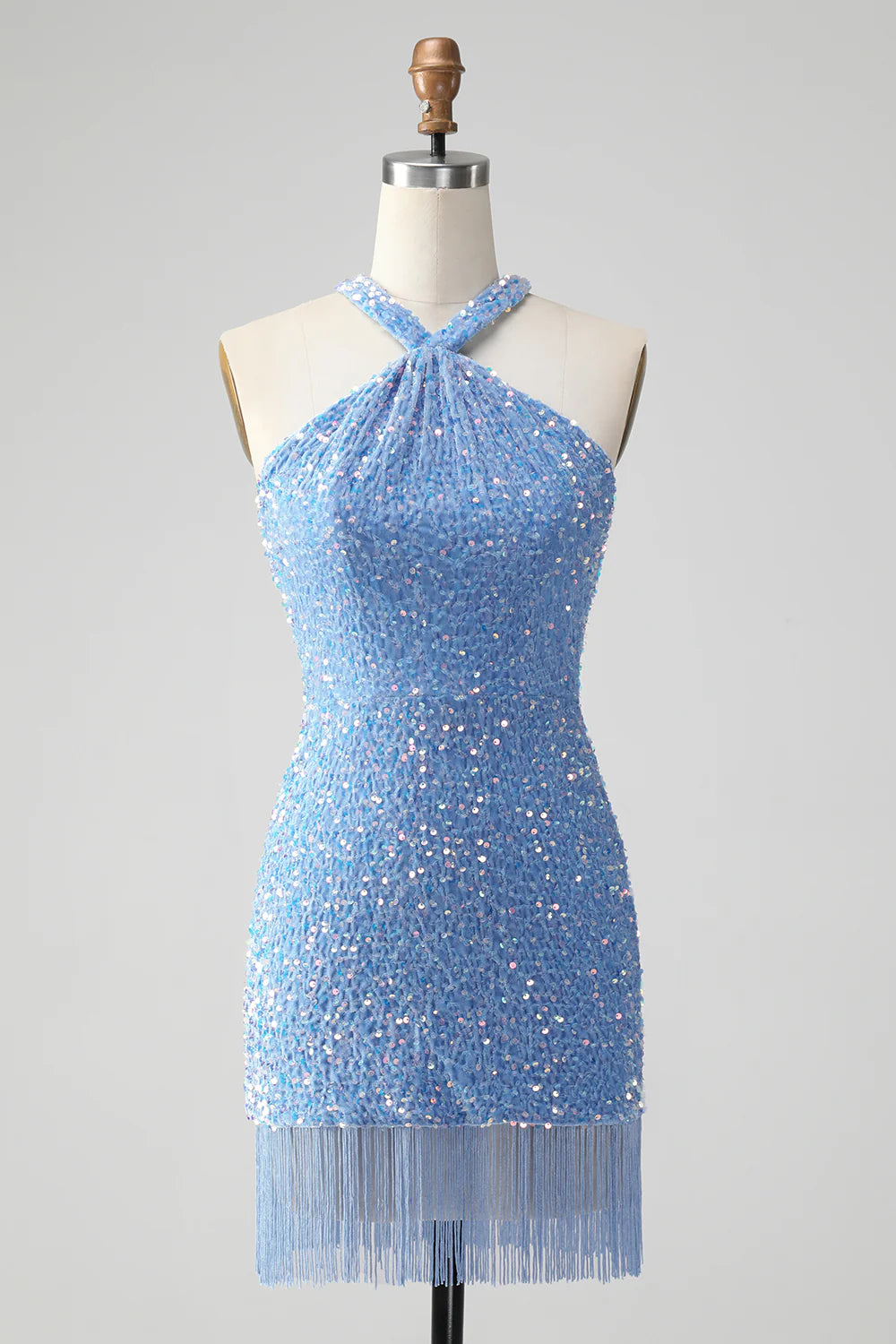 Close-up of the royal blue sequin fabric and halter neckline.
