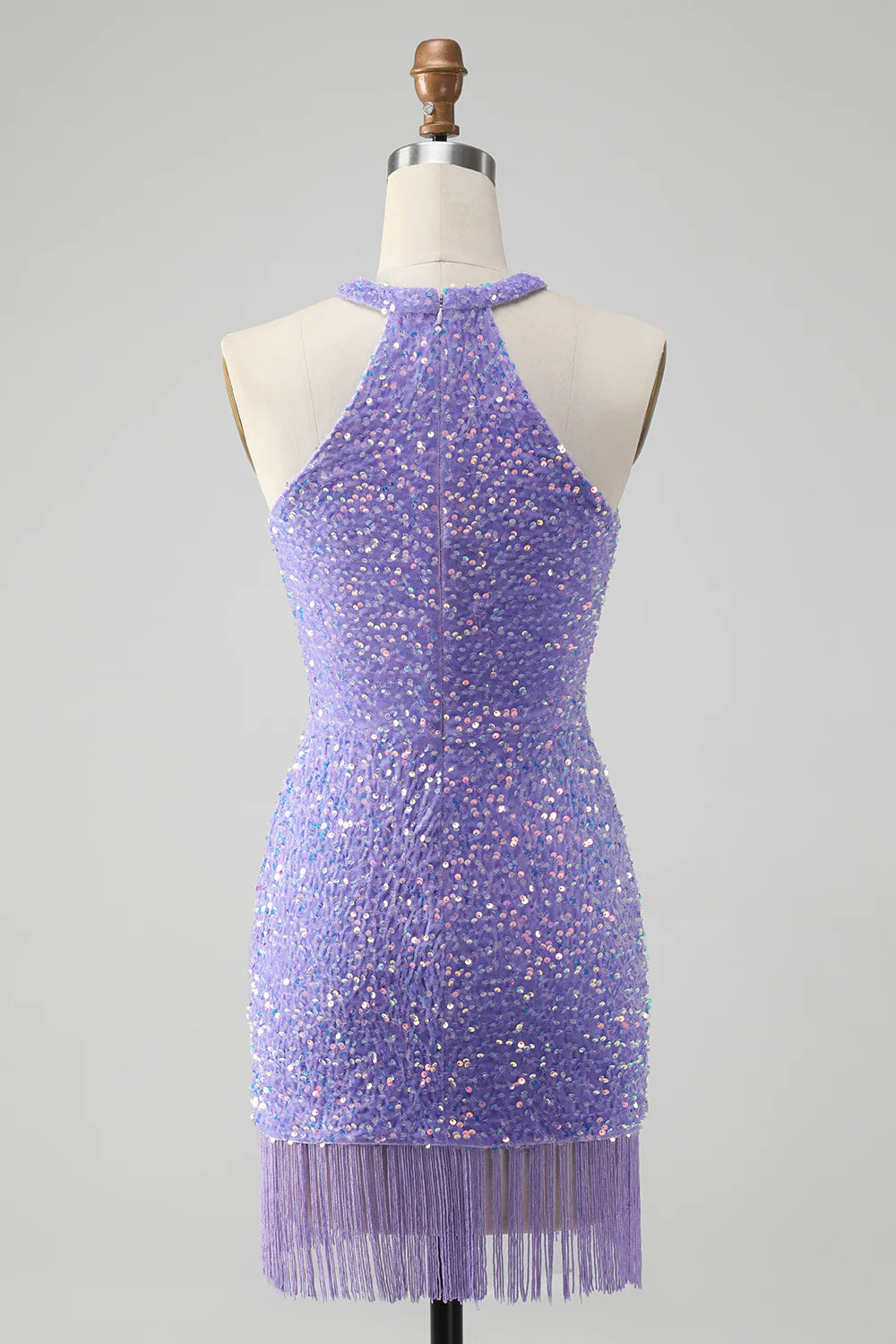 Back view of a lilac sequin short dress with halter neckline.