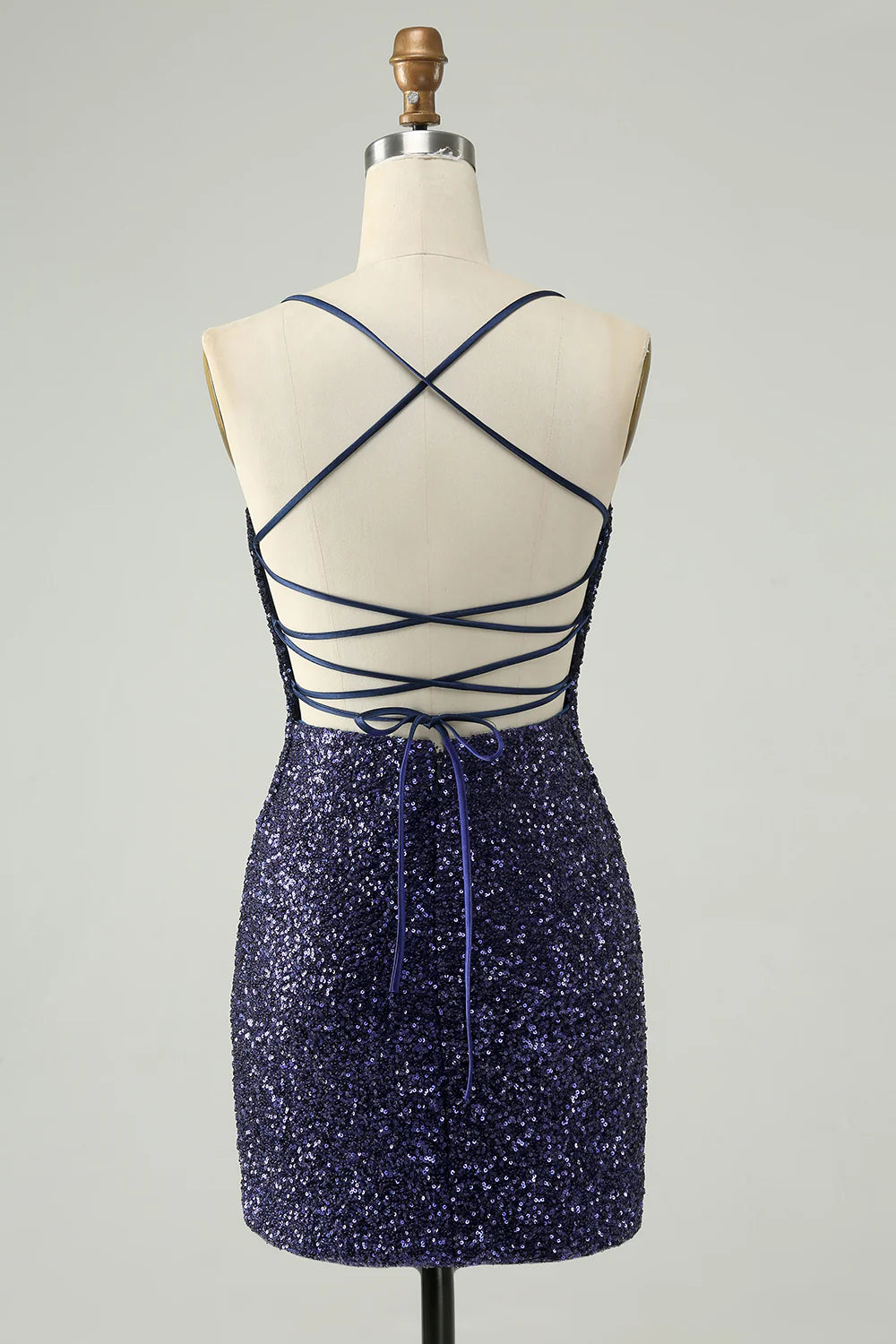 Back view of navy sequined bodycon dress with spaghetti straps.