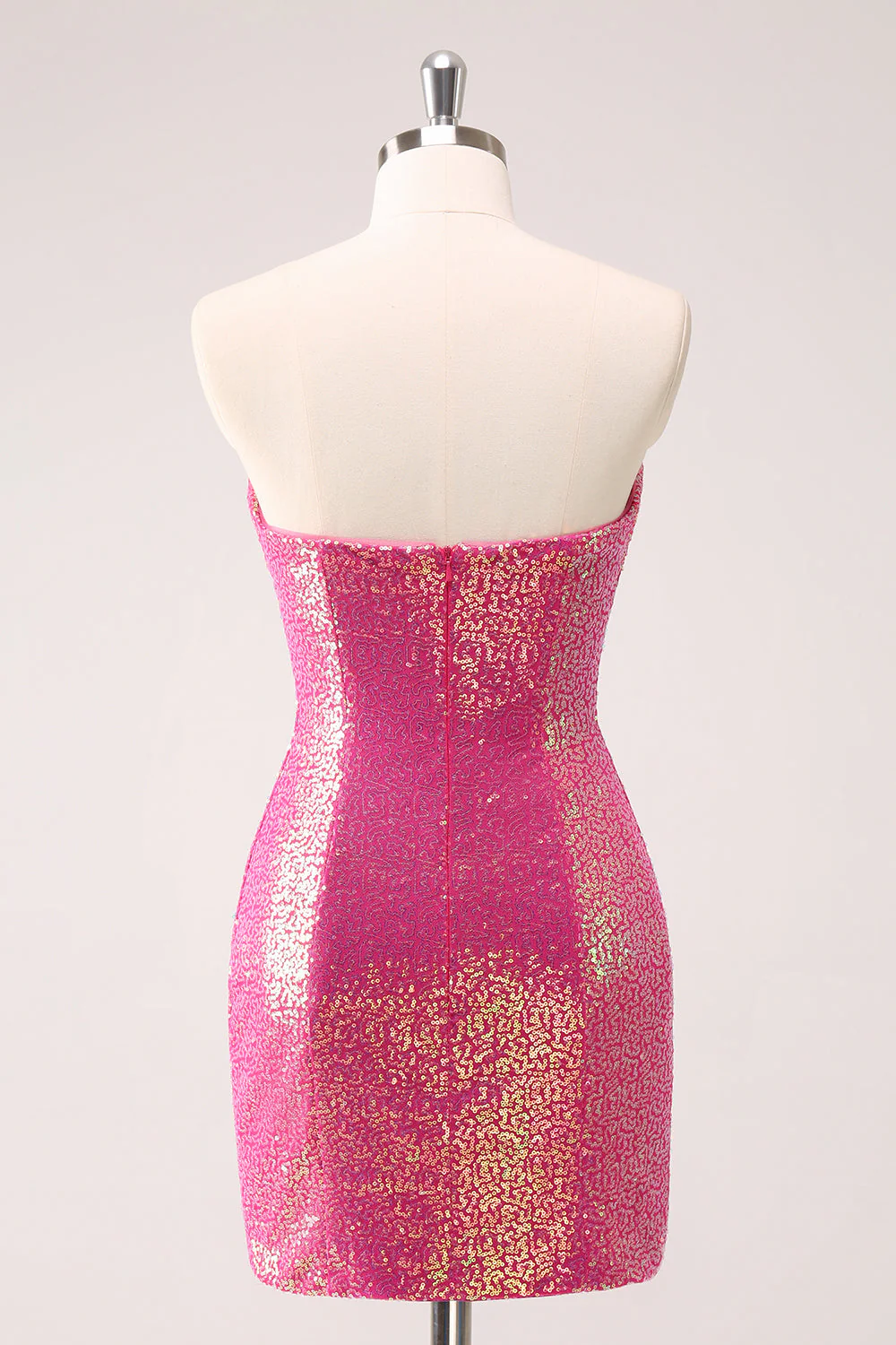 Back view of a sparkly fuchsia bodycon strapless short homecoming dress with sequin details.