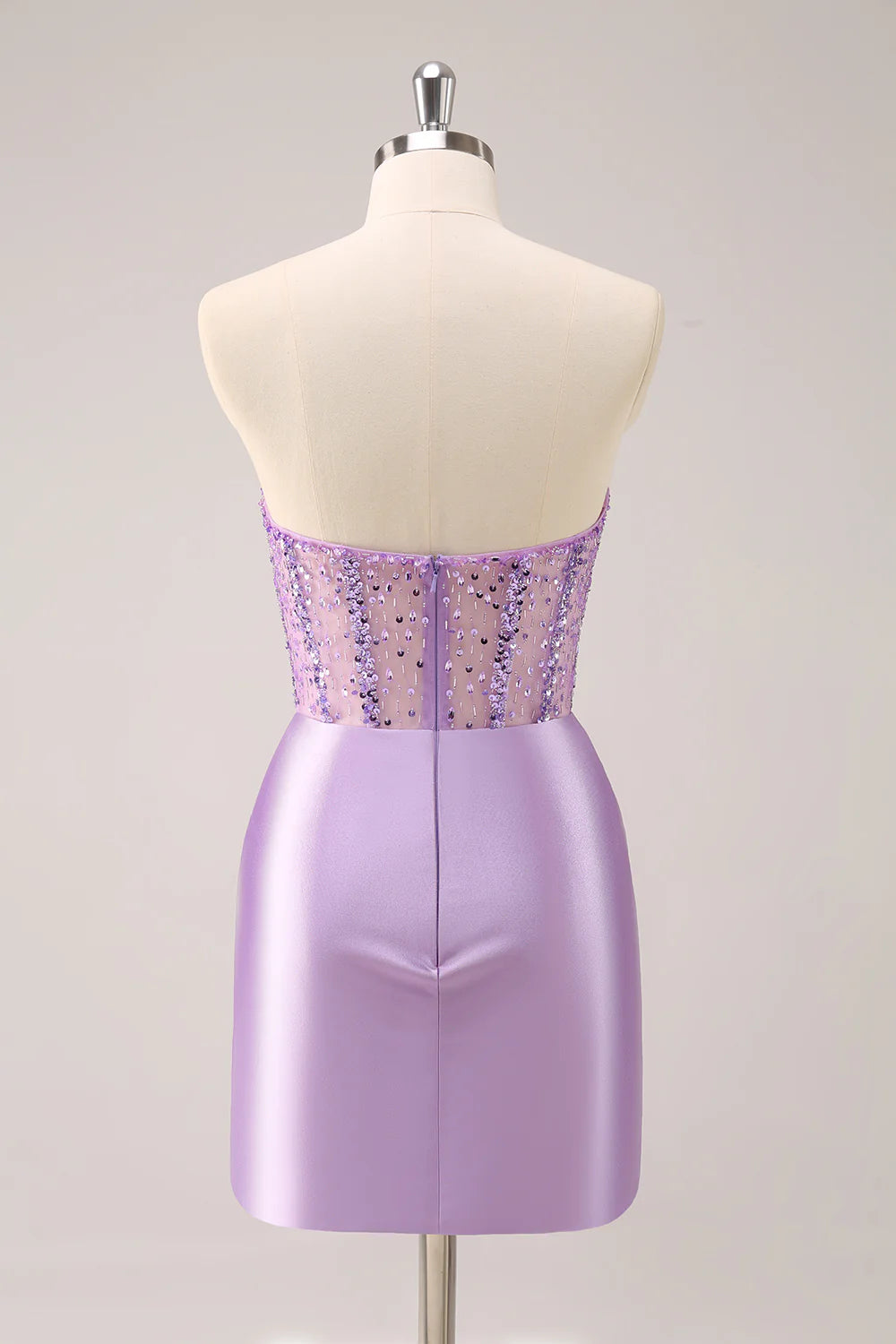 Back view of a model wearing the ruched lilac sequin short dress.