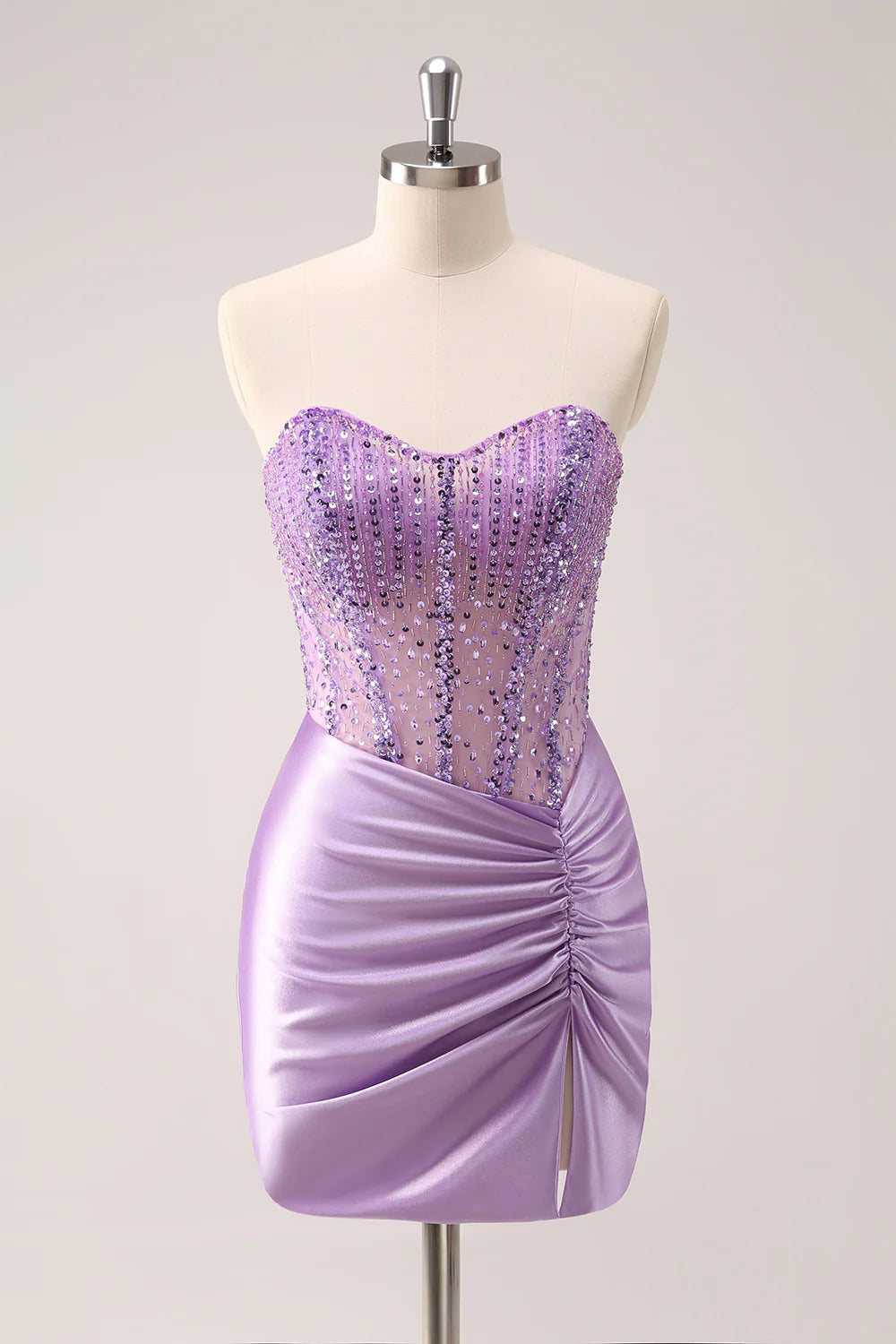 Close-up of the beaded and sequined detail on the lilac bodycon dress.