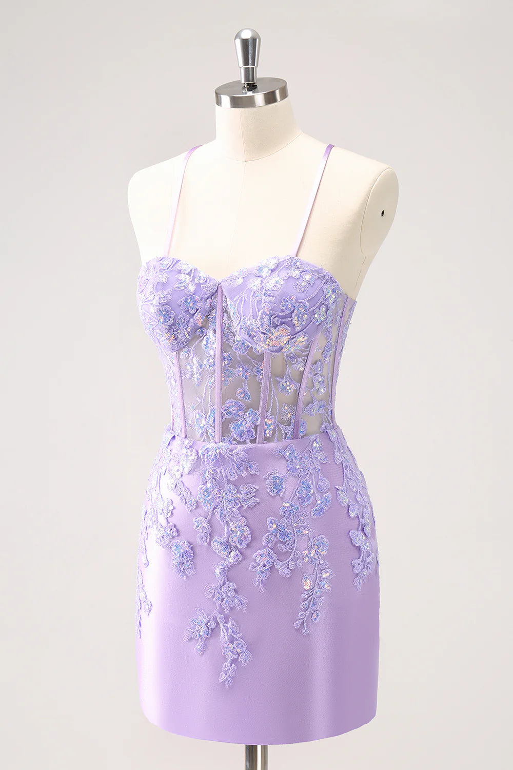 Back view of a sparkly lilac bodycon spaghetti strap sequin dress with appliques.