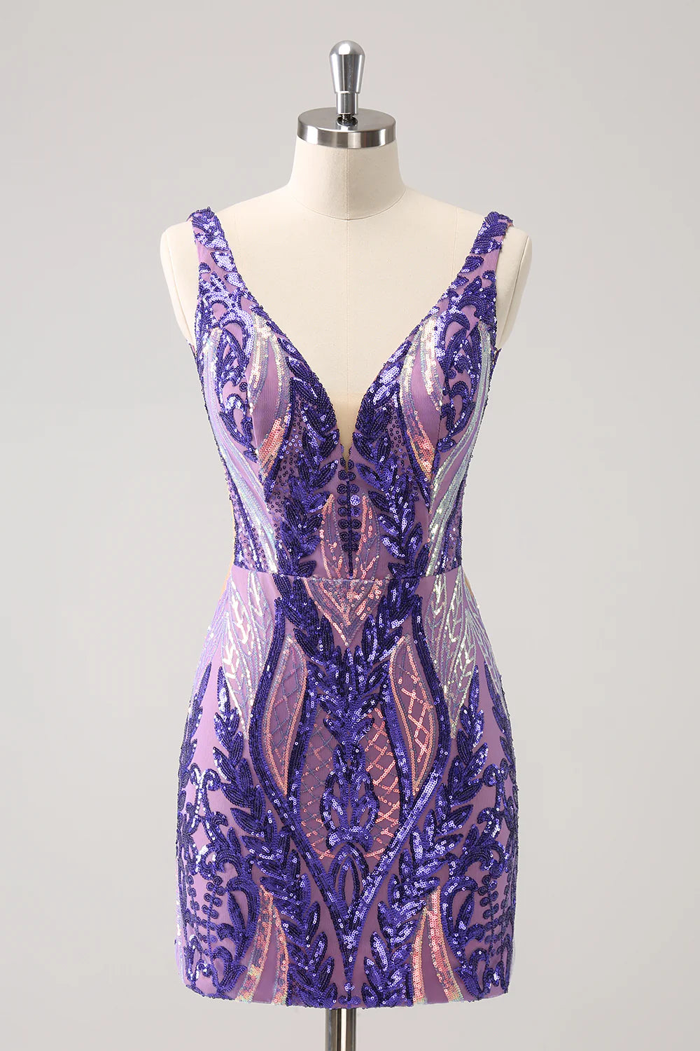Side view of a woman wearing a short dark purple sequin bodycon dress.