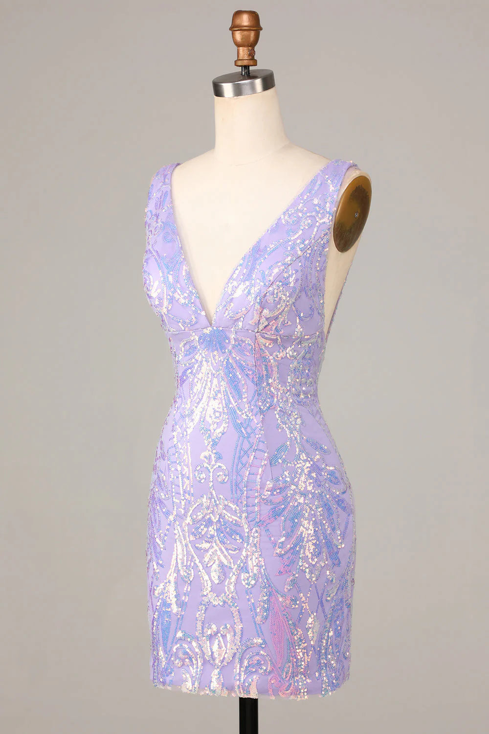 Side view of a woman wearing a lilac sequin V-neck dress.