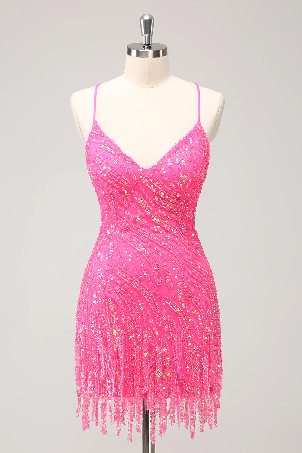 Sparkly gold sequin bodycon dress with spaghetti straps and tassels.