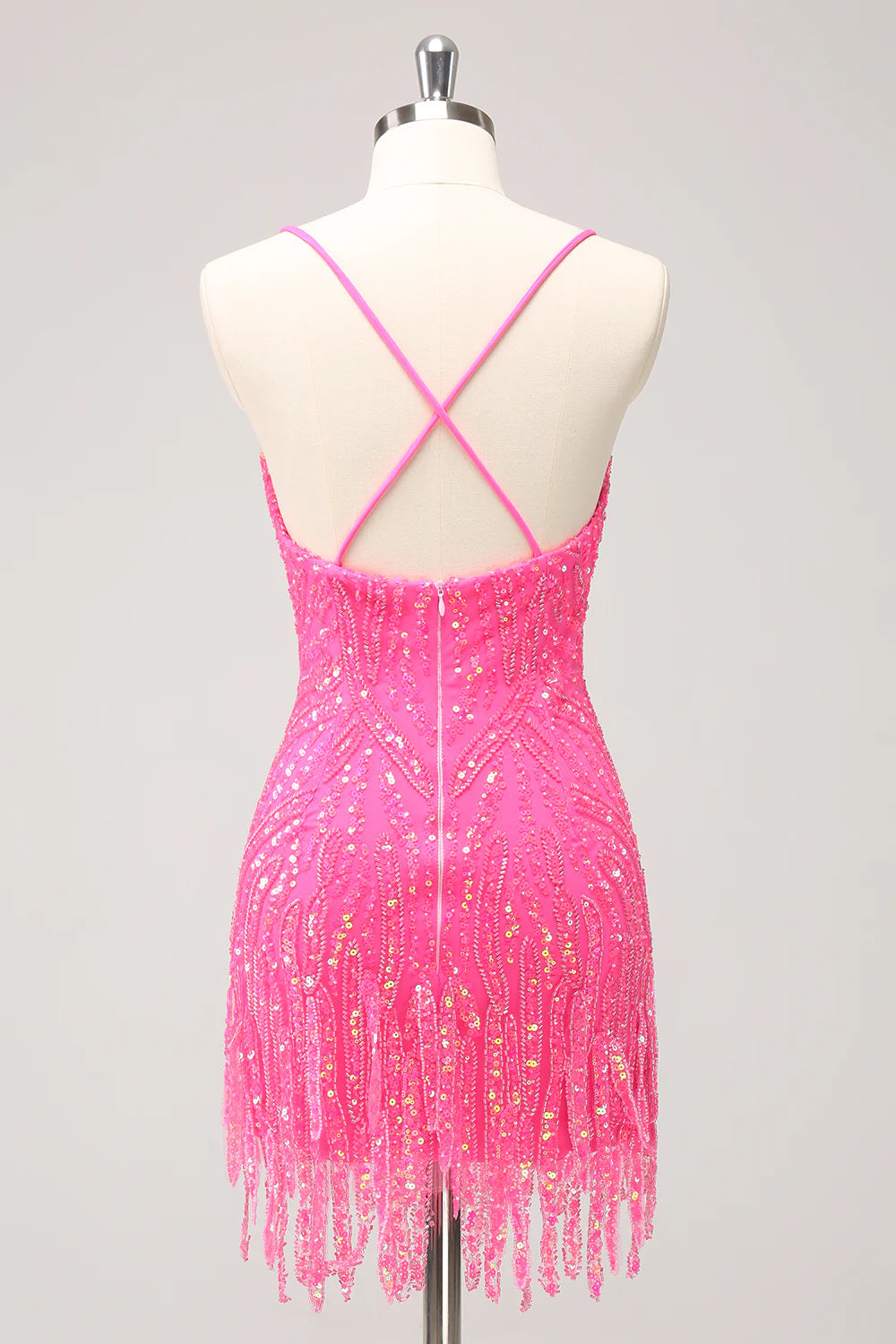 Back view of a gold sequin bodycon dress with playful tassels.