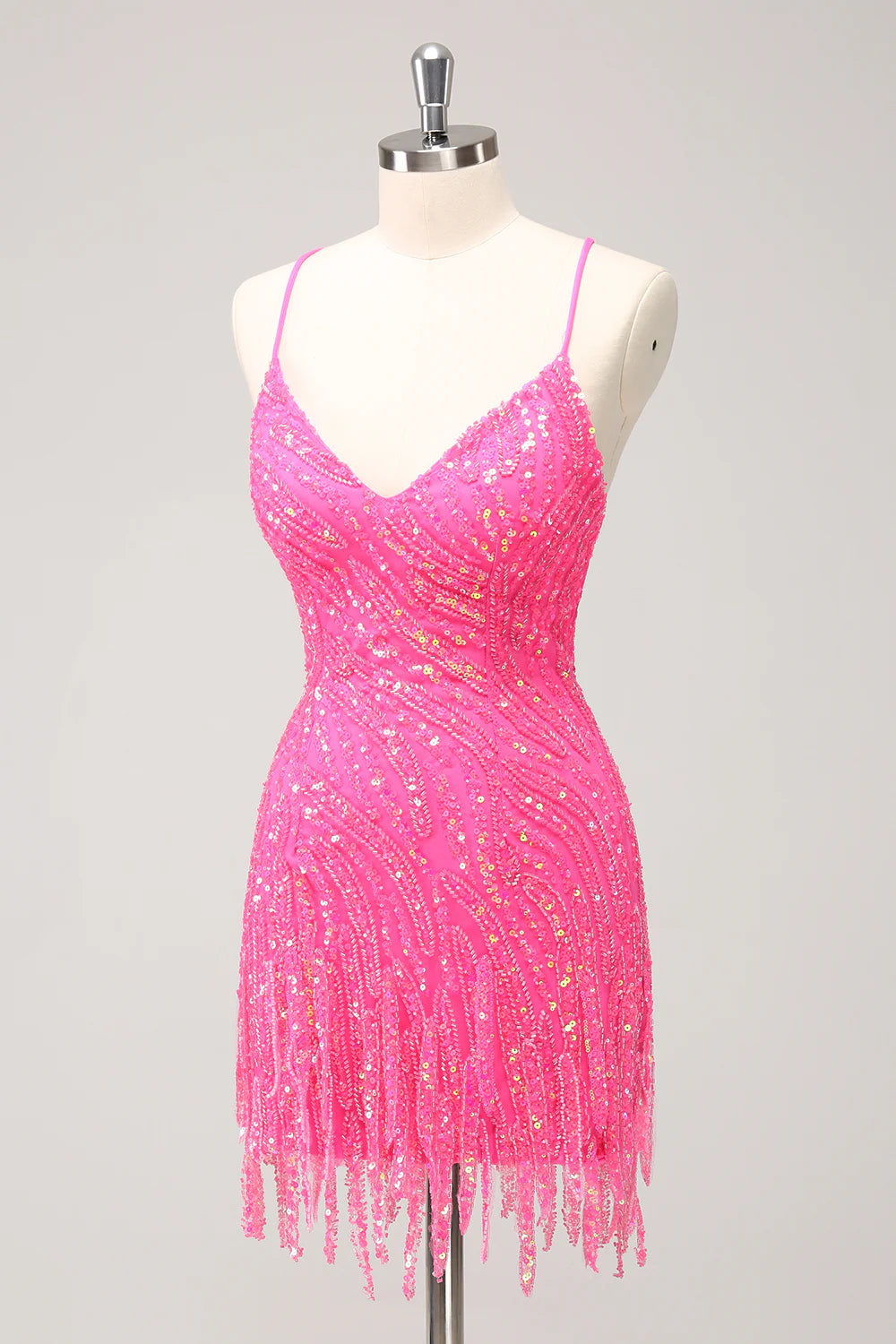 Side profile of a woman wearing a gold sequin homecoming dress.