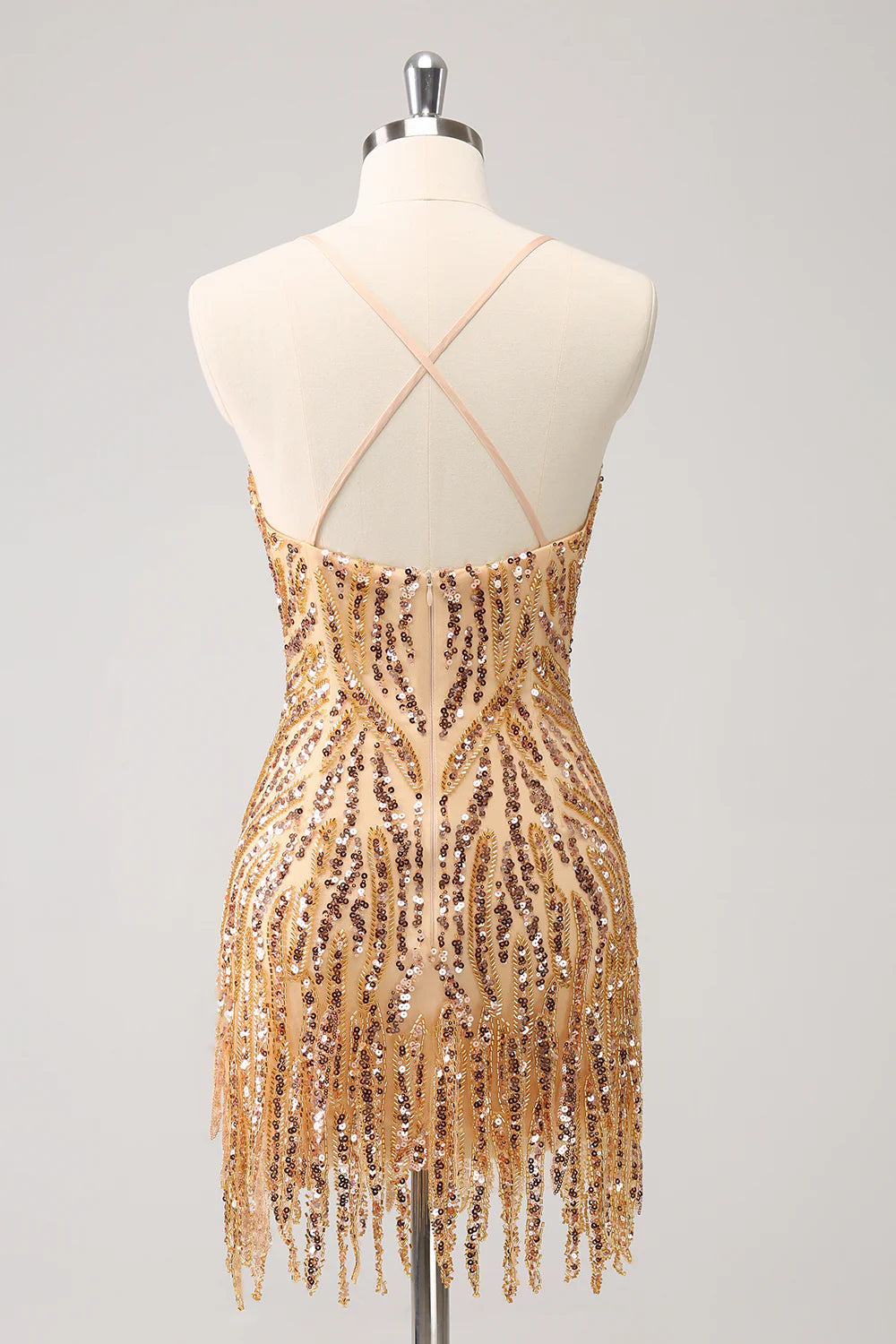 Close-up of the intricate gold sequin fabric and tassel embellishments.