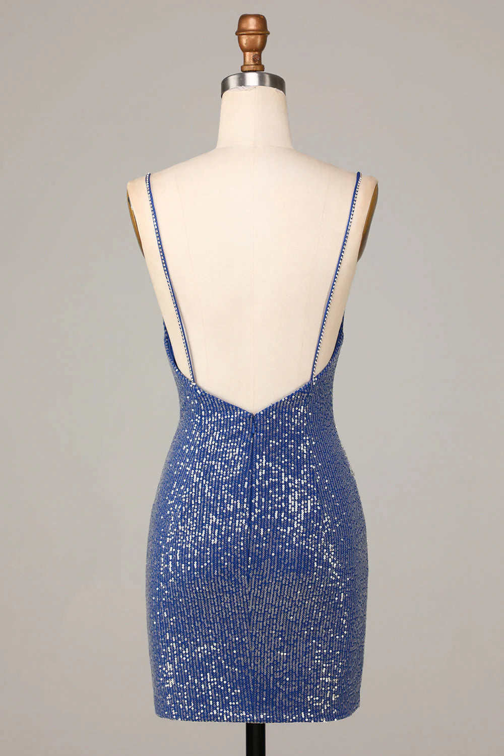 Side view of the short sparkly dark blue sheath dress, highlighting sequin details.