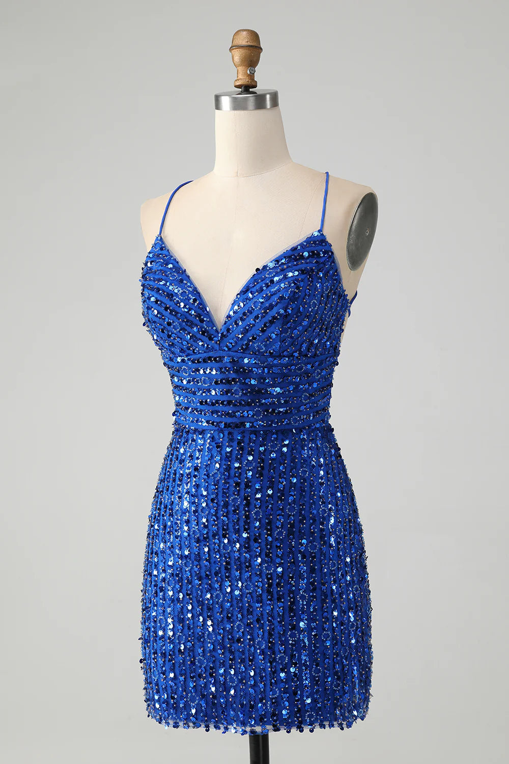 Back view of the royal blue sequin dress with elegant criss-cross straps.