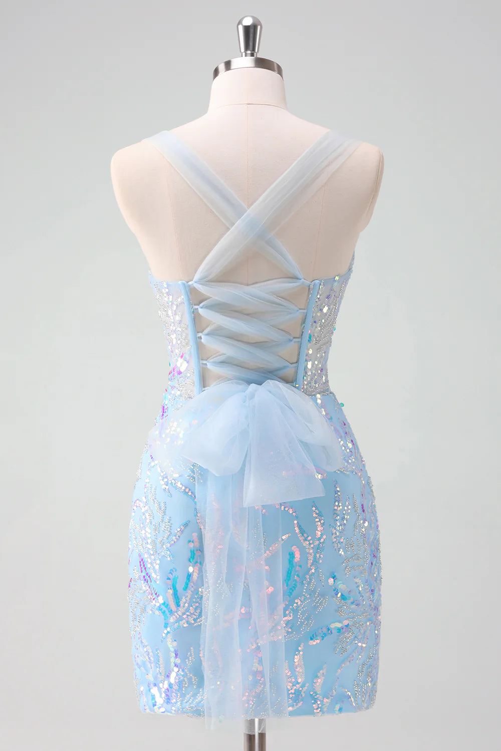 Back view of a light blue sequin homecoming dress showing lace-up corset detail.