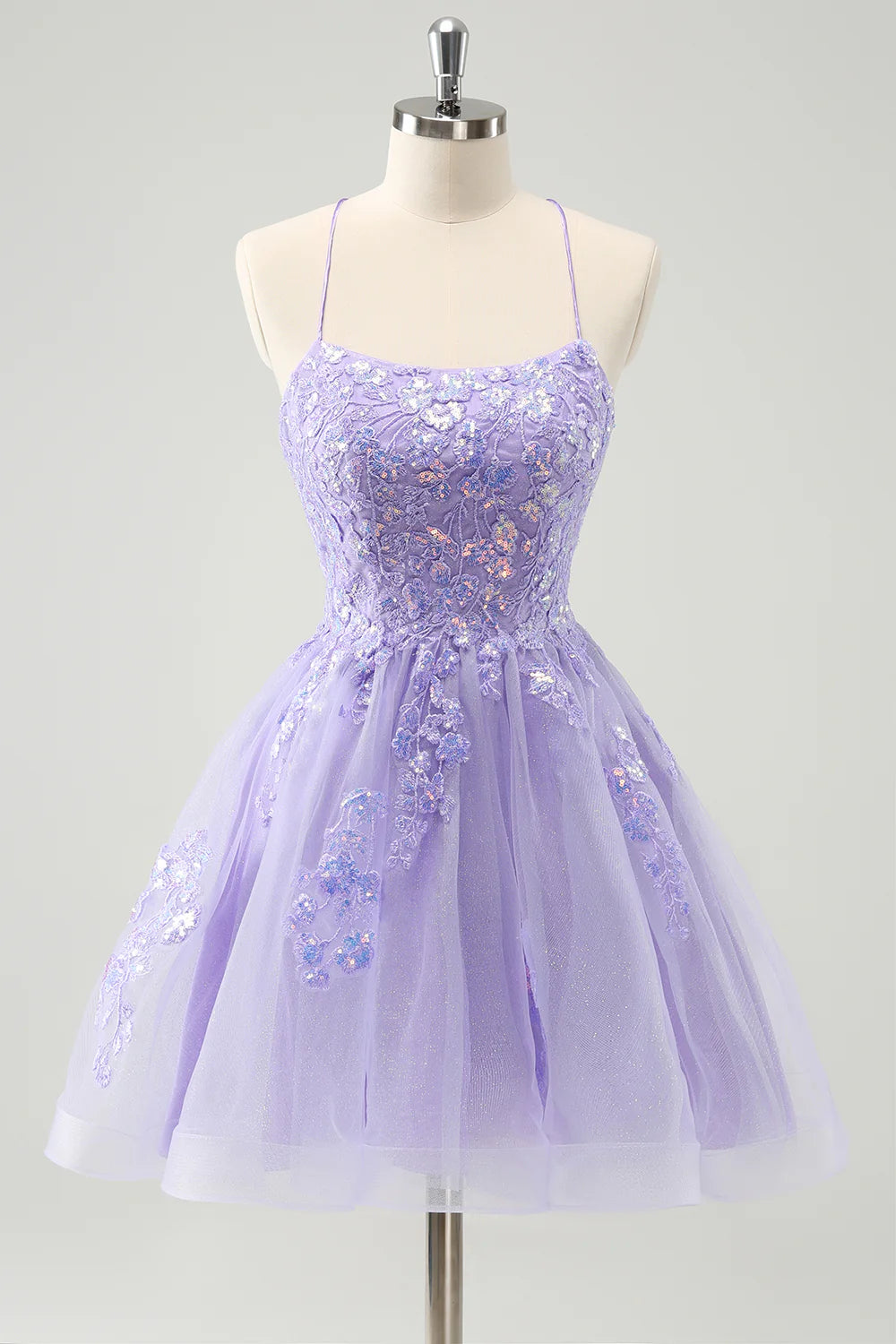 Sparkly lilac A-line sequin short homecoming dress with spaghetti straps and lace-up back, front view.
