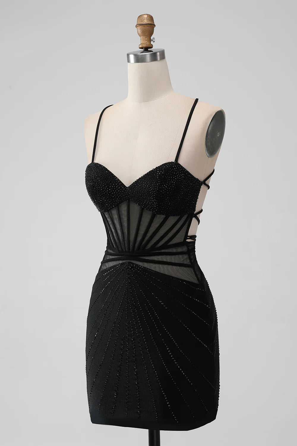 Close-up of beading and sheer fabric on a black mermaid homecoming dress.
