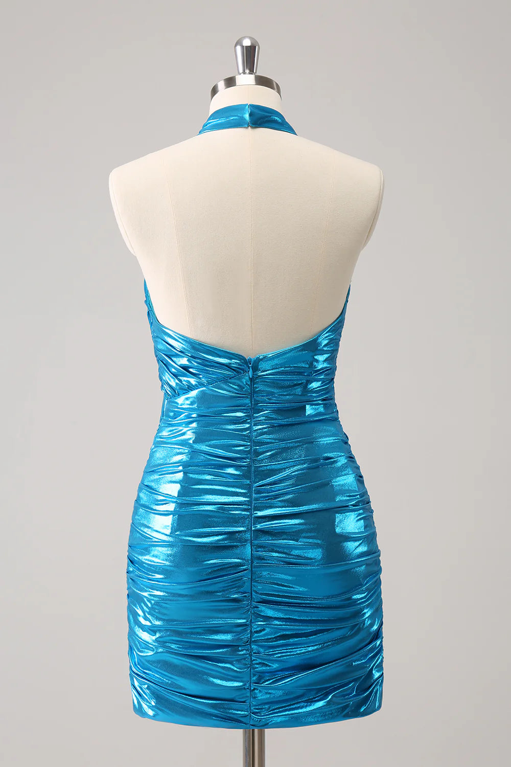 Back view of a woman wearing a sparkly blue halter bodycon dress.