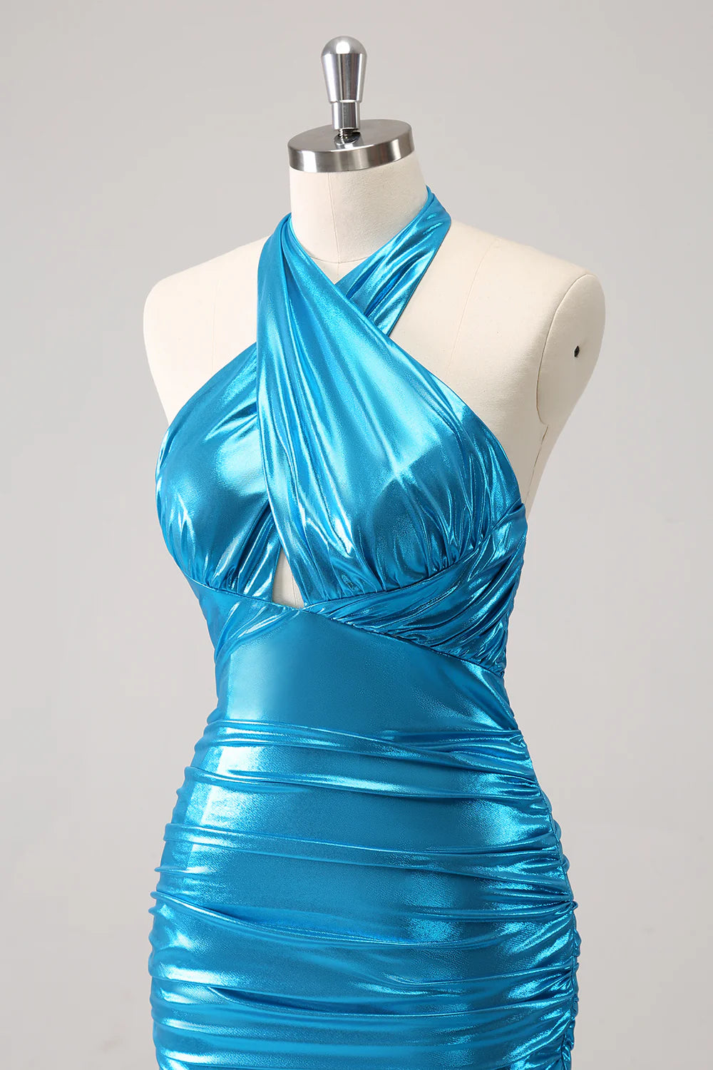 Close-up of the pleated corset and metallic fabric on a blue homecoming dress.