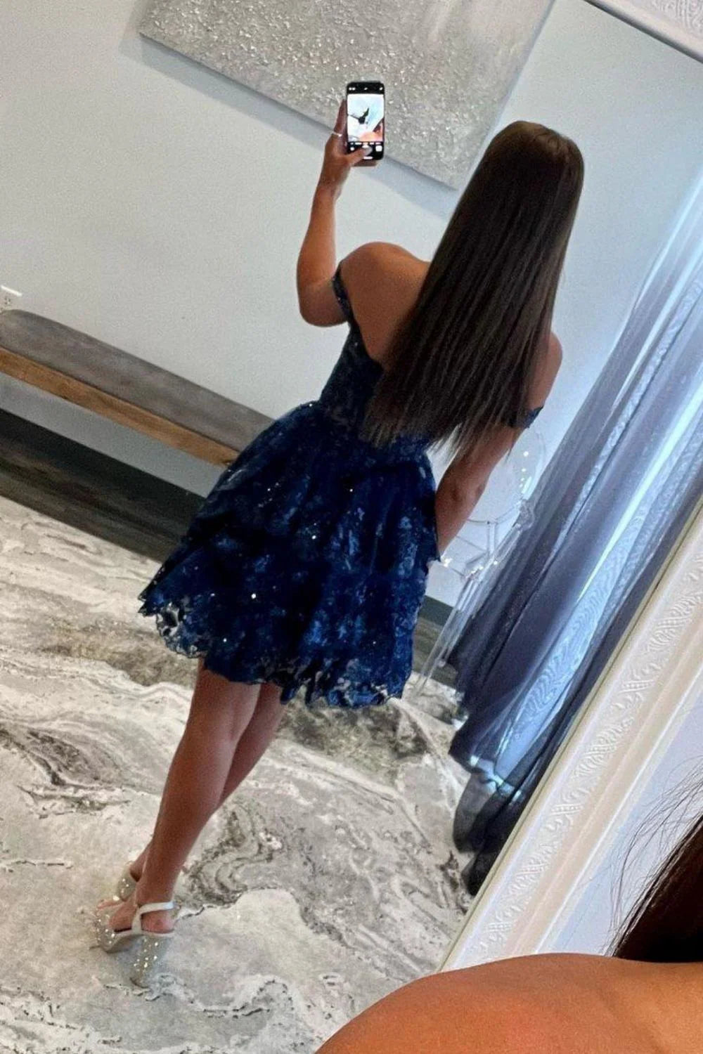 Back view of sparkly navy tiered dress.