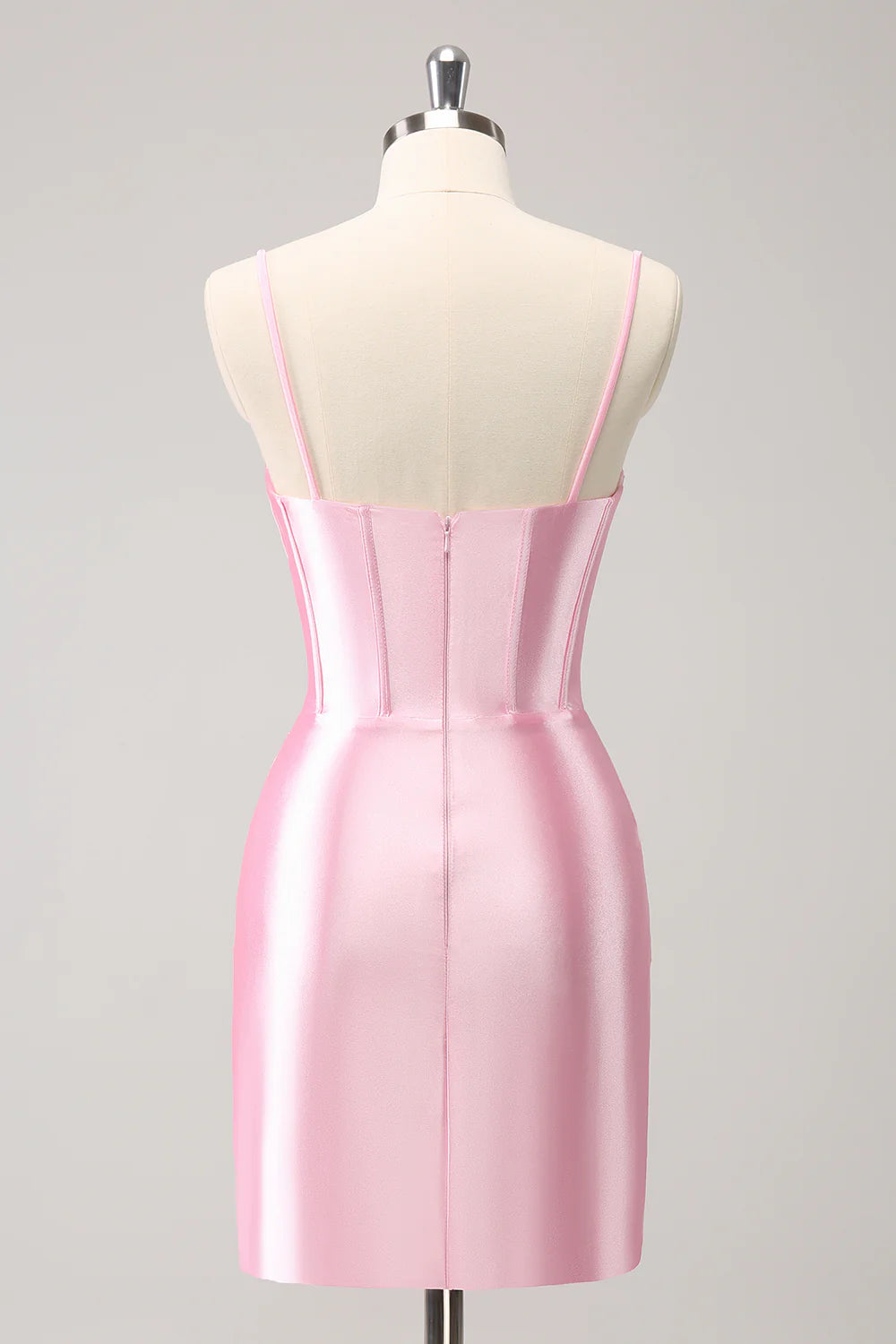 Back view of sparkly pink short homecoming dress with pleated skirt.