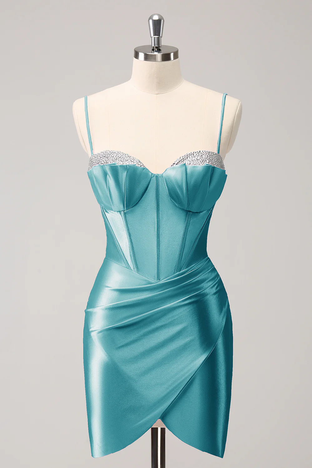 Peacock blue sparkly short homecoming dress with beaded details.