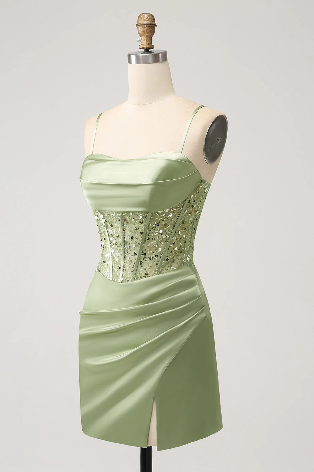Close-up of sequin detail on sage green bodycon dress.