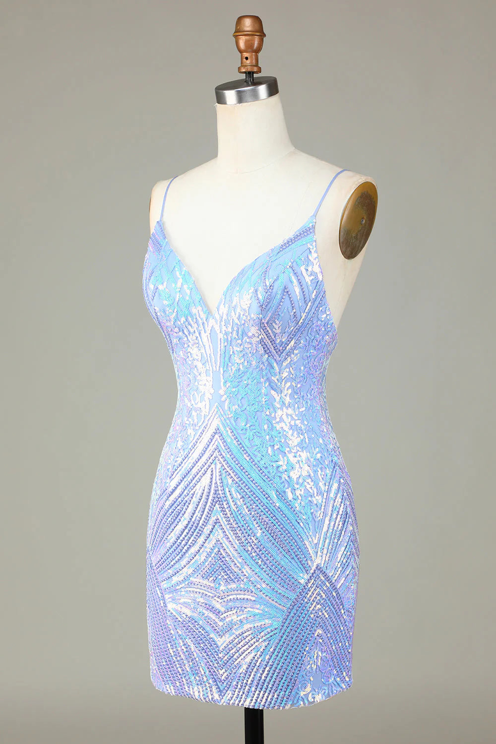 Side view of the blue sequin sheath dress, highlighting its short length and fitted silhouette.