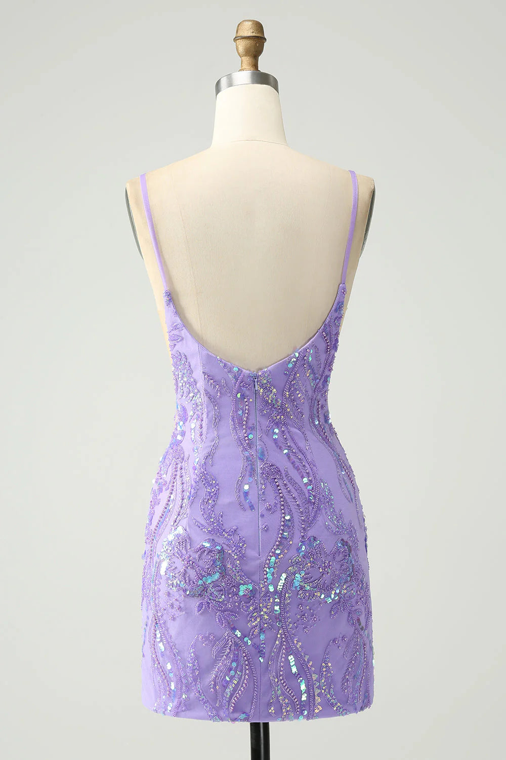 Back view of a sparkly purple sequin short dress with spaghetti straps.