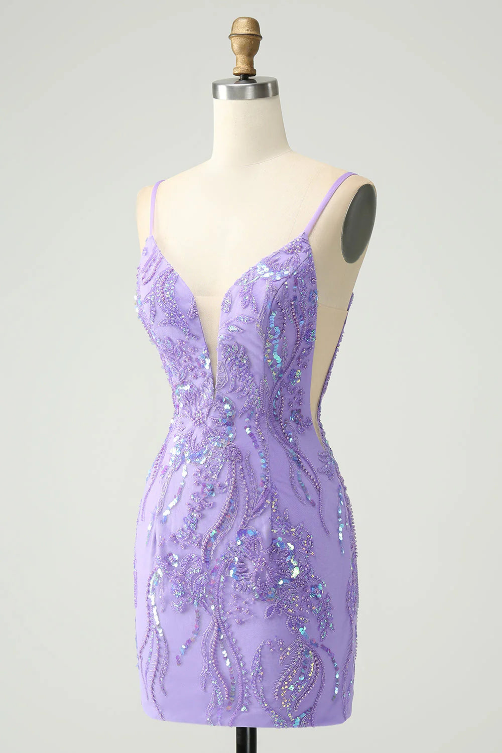 Side view of a woman in a tight purple sequin homecoming dress.