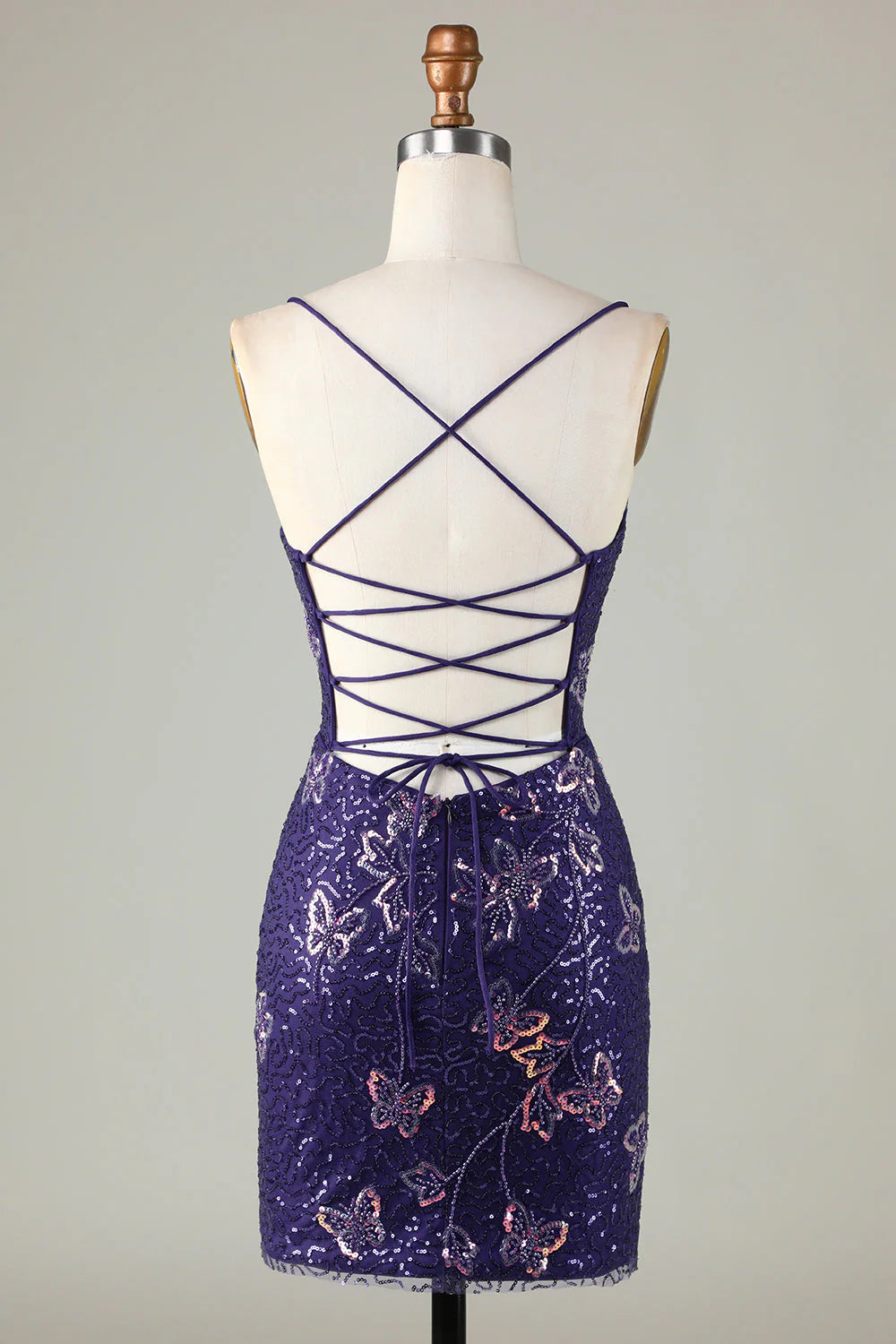 Back view of the sparkly dark purple dress showing criss-cross spaghetti straps.