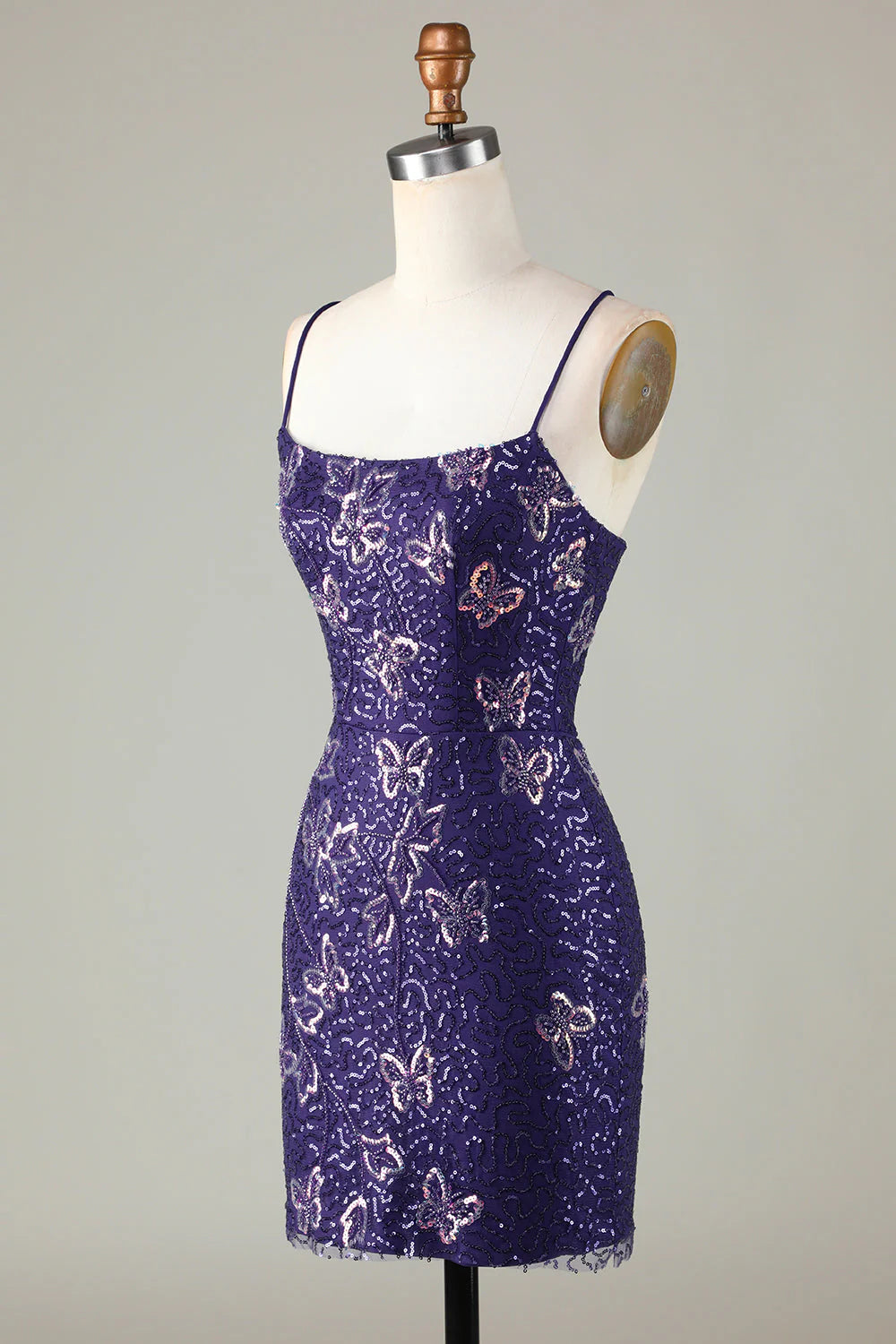 Side view of the sparkly dark purple short sheath dress.