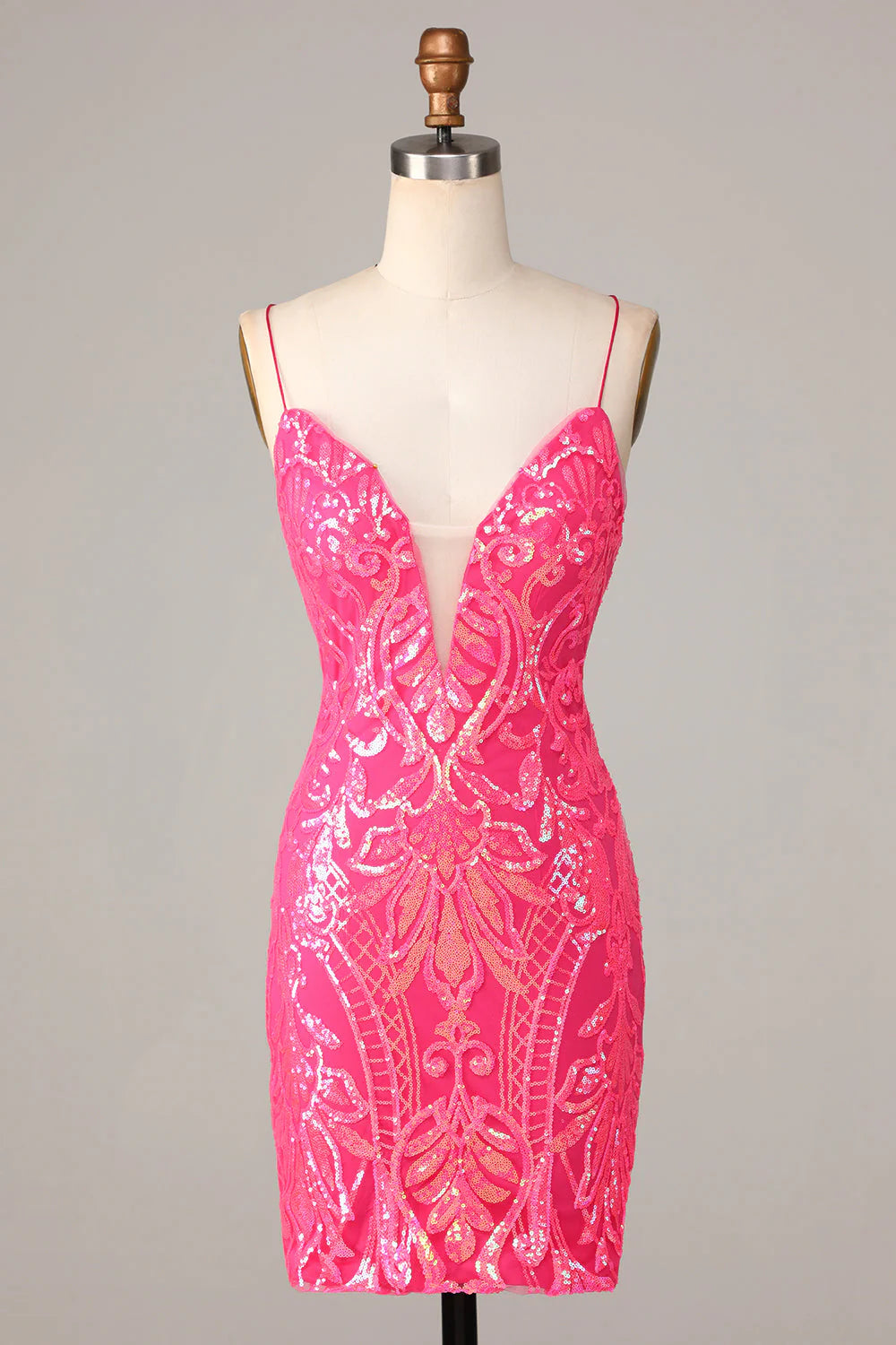 Front view of a sparkly hot pink sequin sheath dress with spaghetti straps.
