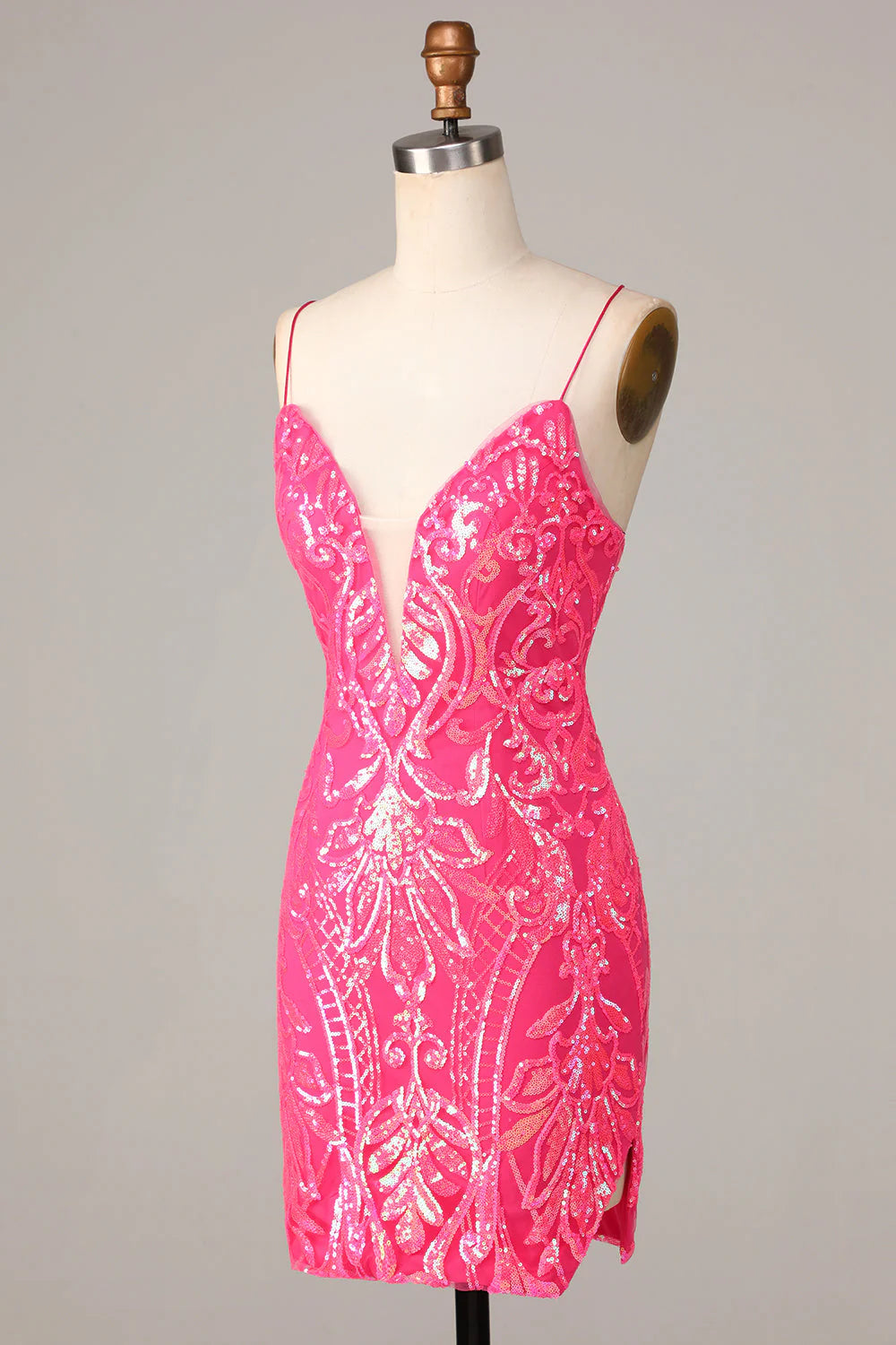 Back view of a sparkly hot pink sequin sheath dress with spaghetti straps.