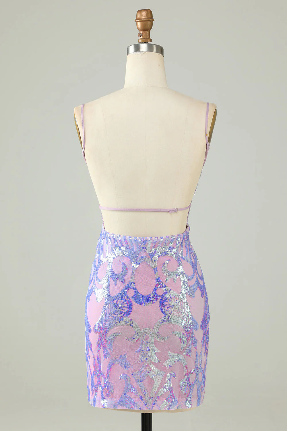 Back view of a sparkly purple sequin sheath dress showing the backless design.