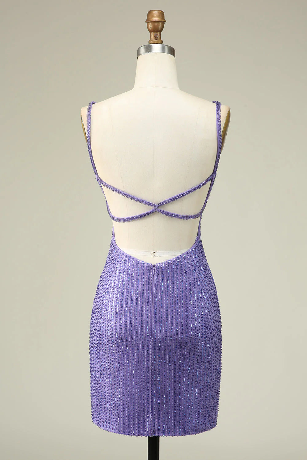 Back view of purple sequin dress showing lace-up detail.